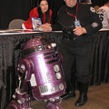 Orli Shashan from Star Wars posing with man who had a remote control R2D2.