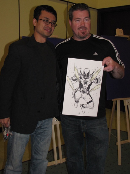 Khoi Pham with his Deadpool sketch and the fan that won it.JPG