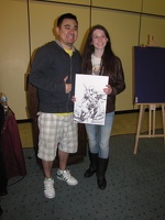 Marcio Takara with Deadpool sketch and the fan that won it