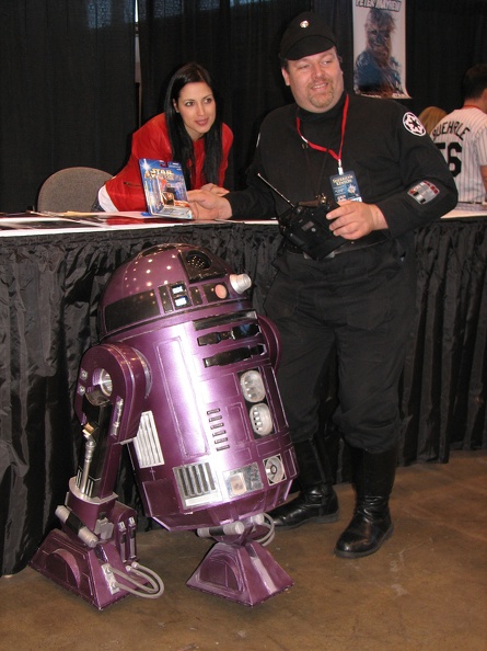 Orli Shashan from Star Wars posing with man who had a remote control R2D2..JPG