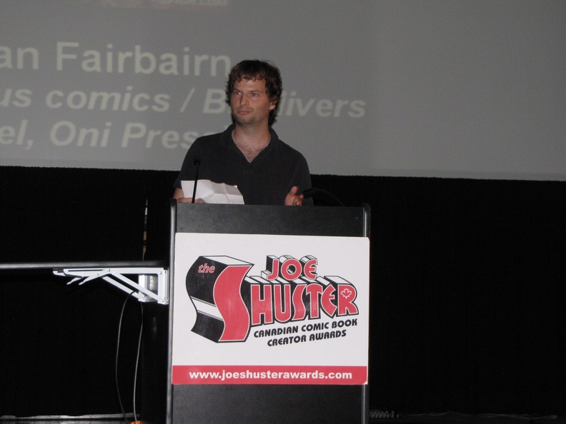 Mike - friend of Nathan Fairbairn accepting the Outstanding Comic Book Colourist Award.JPG